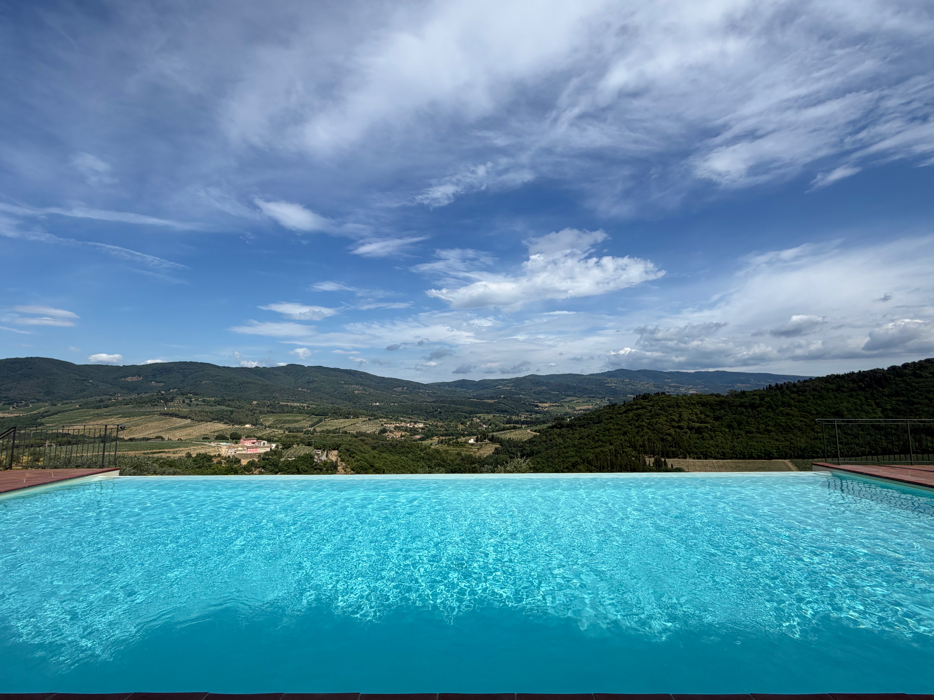 Infinity pool at Castello Vicchiomaggio overlooking the Chianti hills